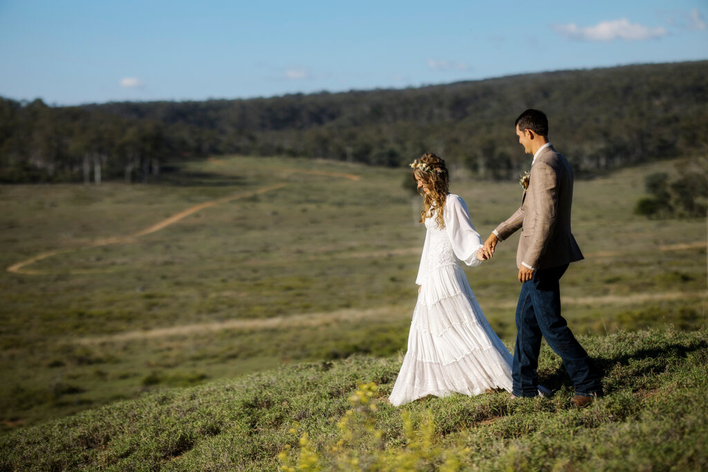 wedding couple walking in rural setting