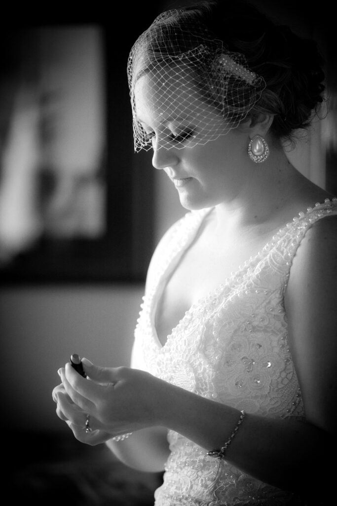 classic black and white portrait of bride getting ready