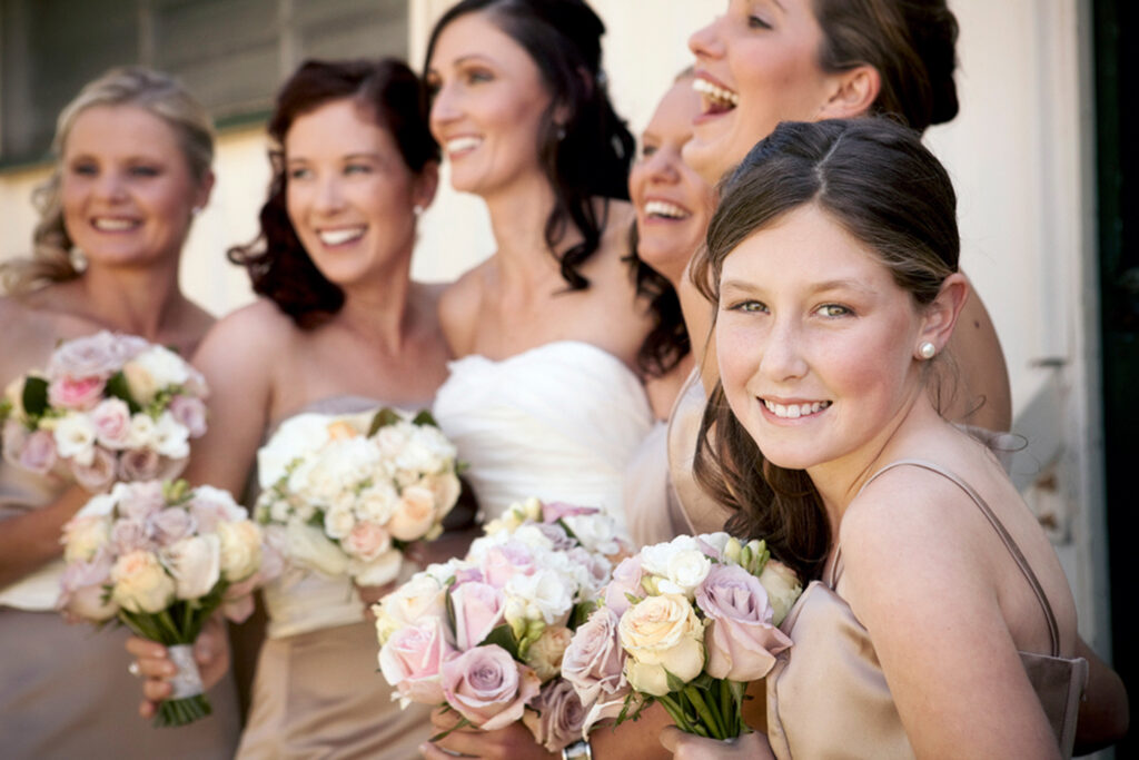 captured image of bridesmaids and flower girl