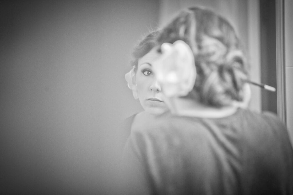 bride getting ready putting on makeup