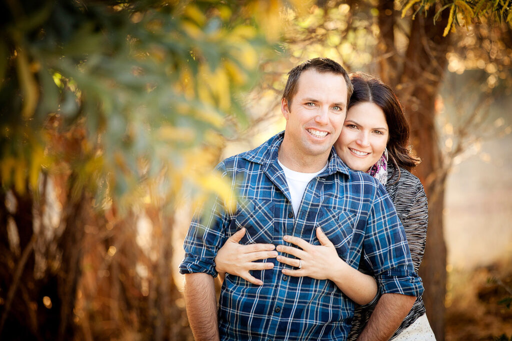 engaged couple cuddling
