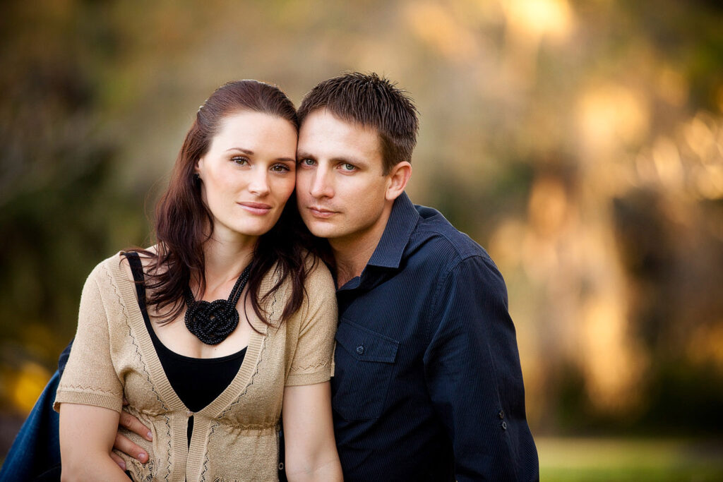 engaged couple in garden setting