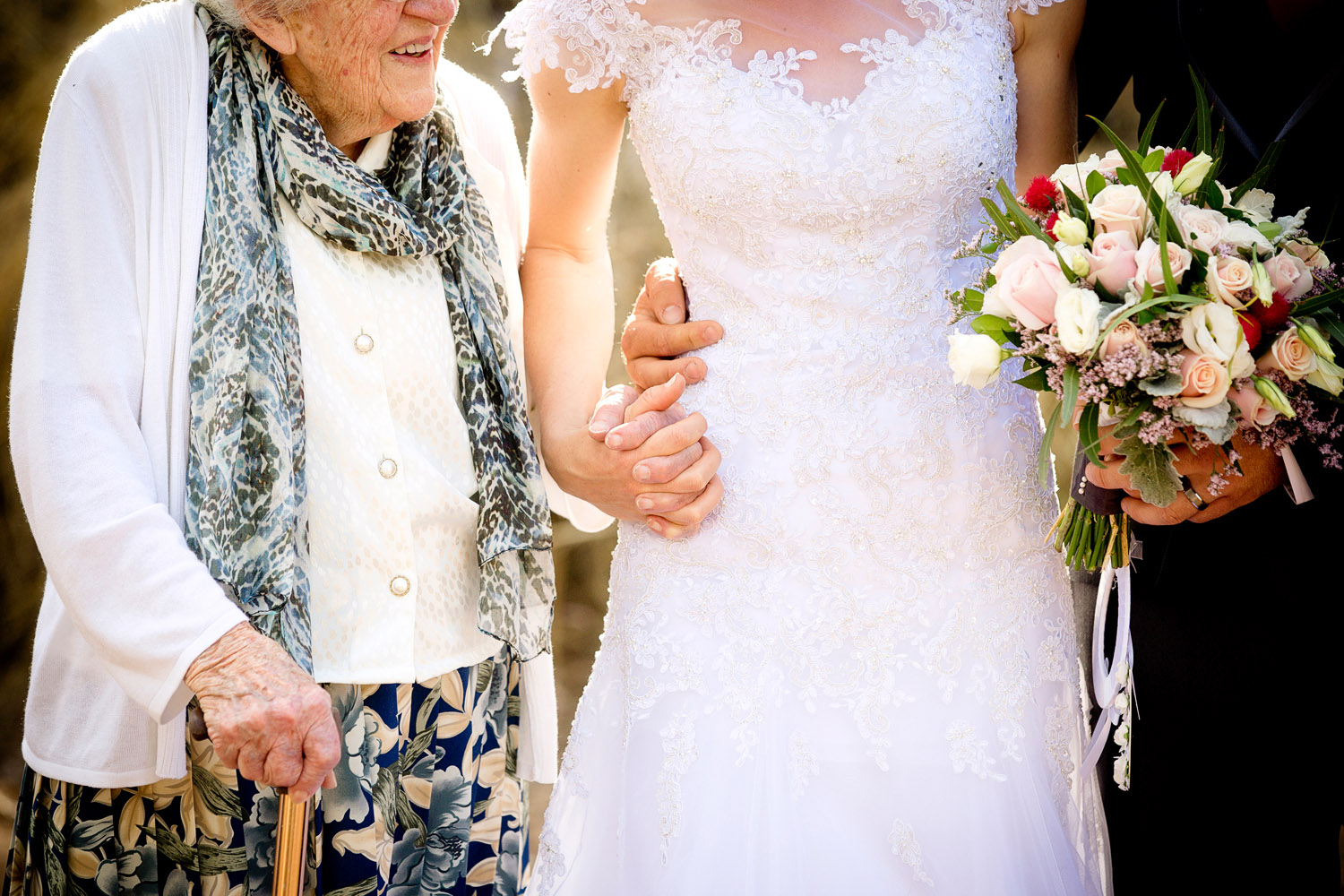 bride holding hands with grandmother