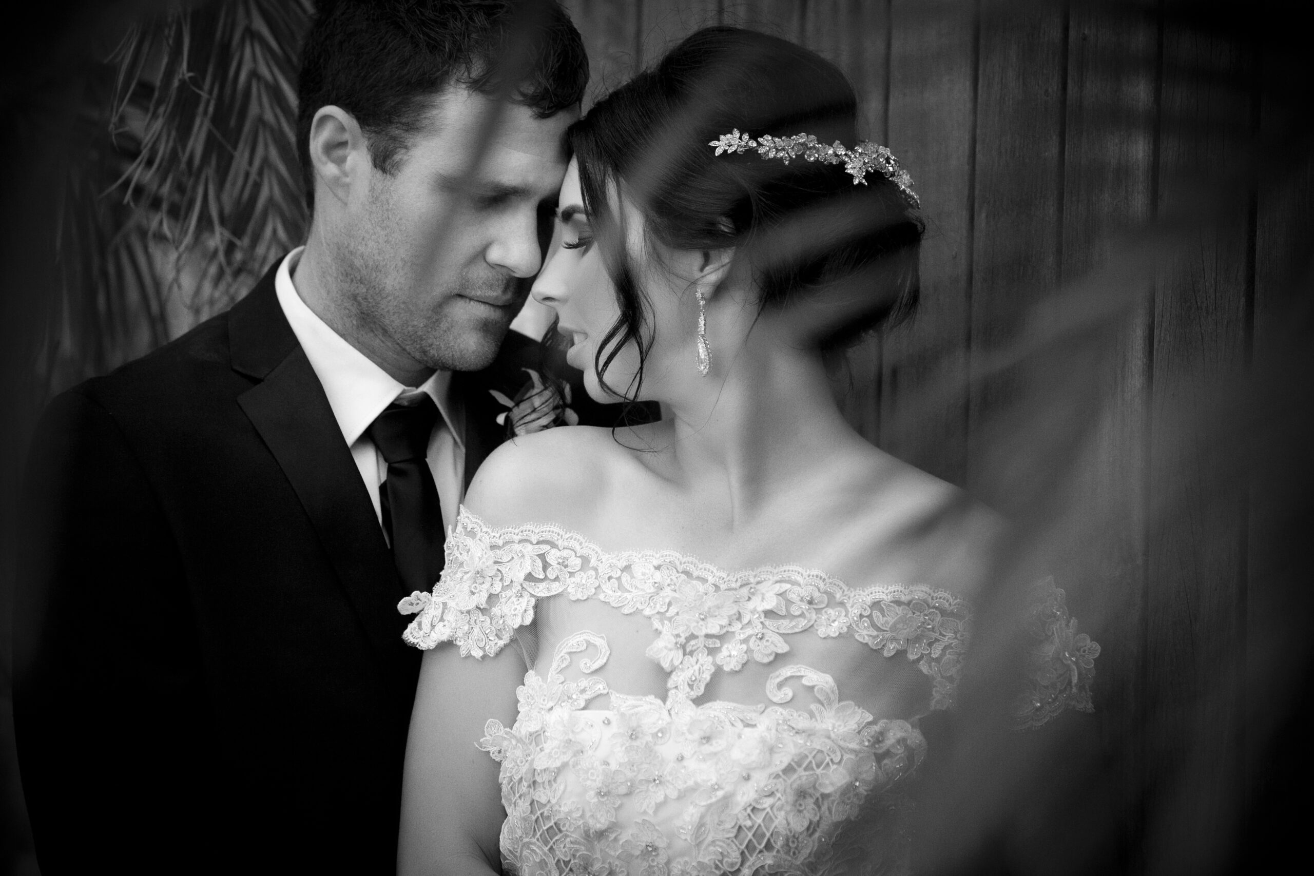 bridal couple cuddling together in private moment
