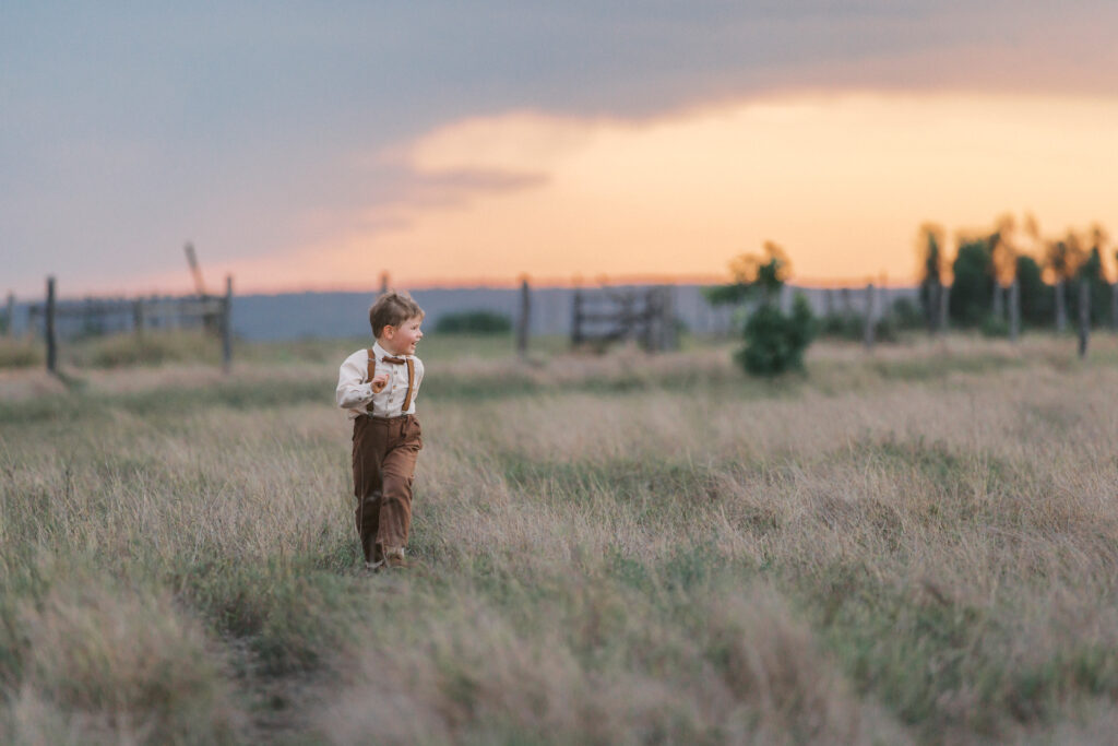 boy running in field