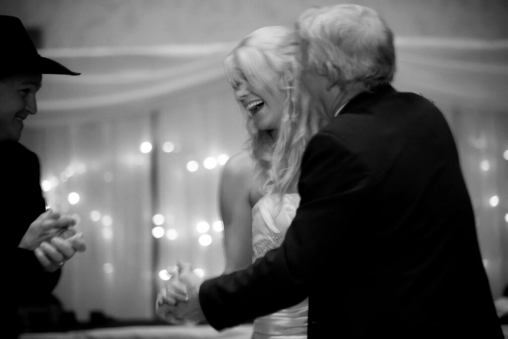bride dancing with father, while groom watches on, laughing, how it felt
