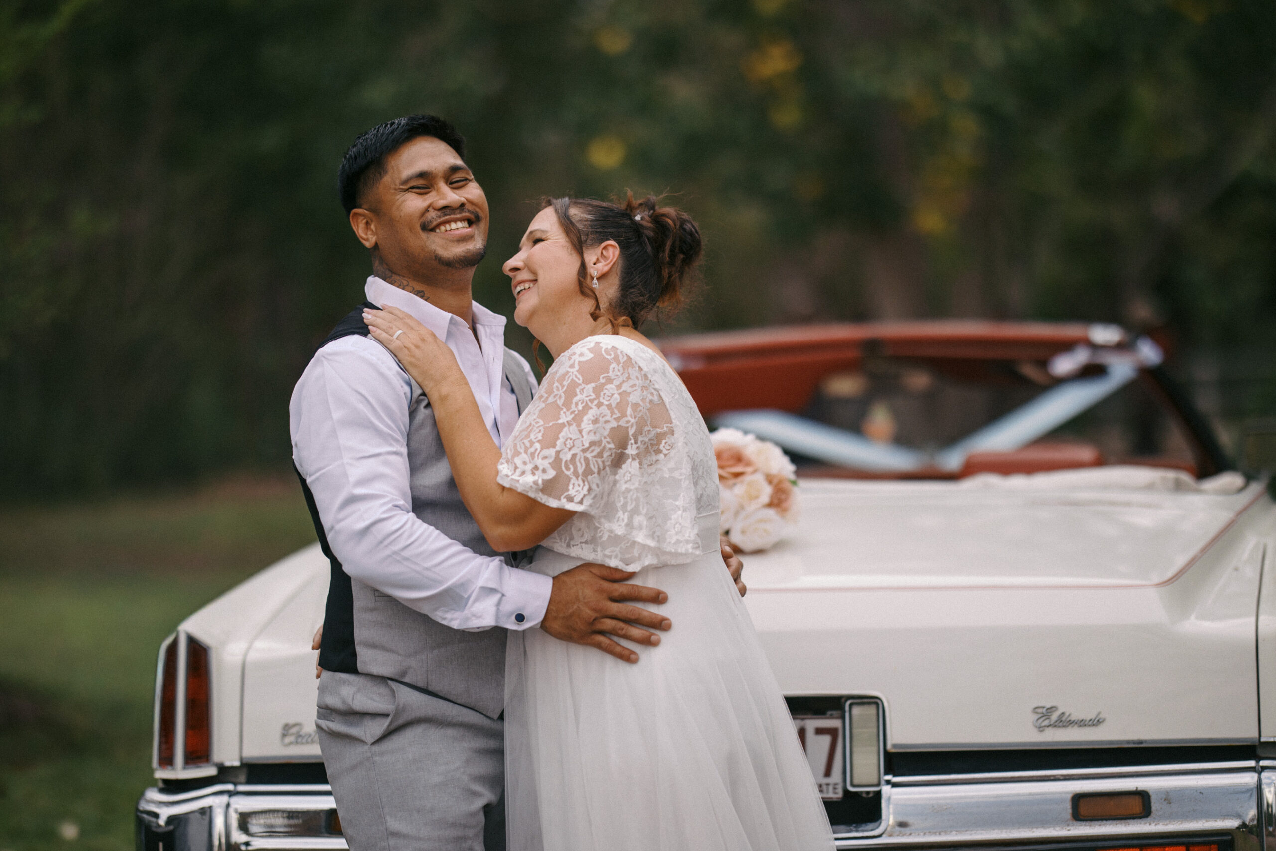 bride and groom on relaxed wedding day having a laugh