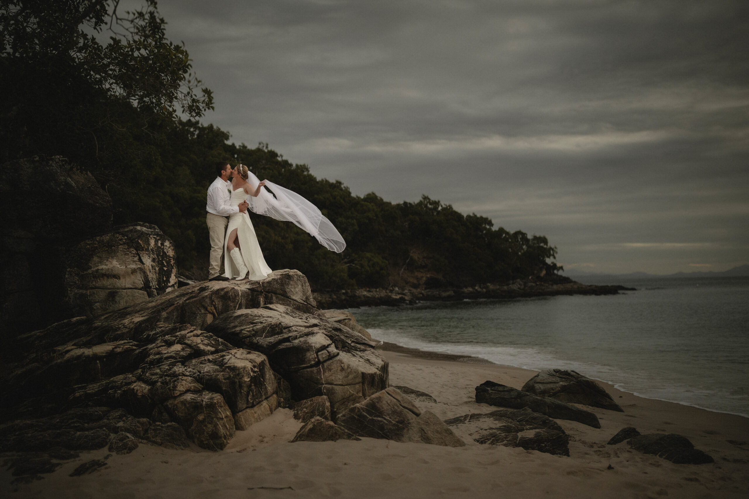 bride and grooms on rocks at Great Keppel Island